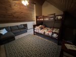 Loft sleeping area with full/twin bunk and sleeping couch